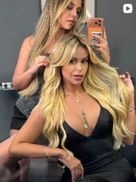 Client with wavy blonde hair extensions in the studio